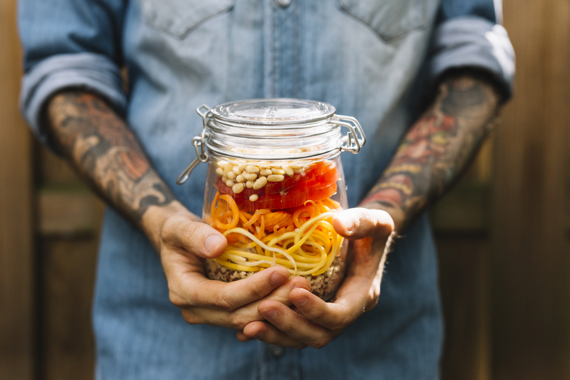 Hands preparing fermented jar